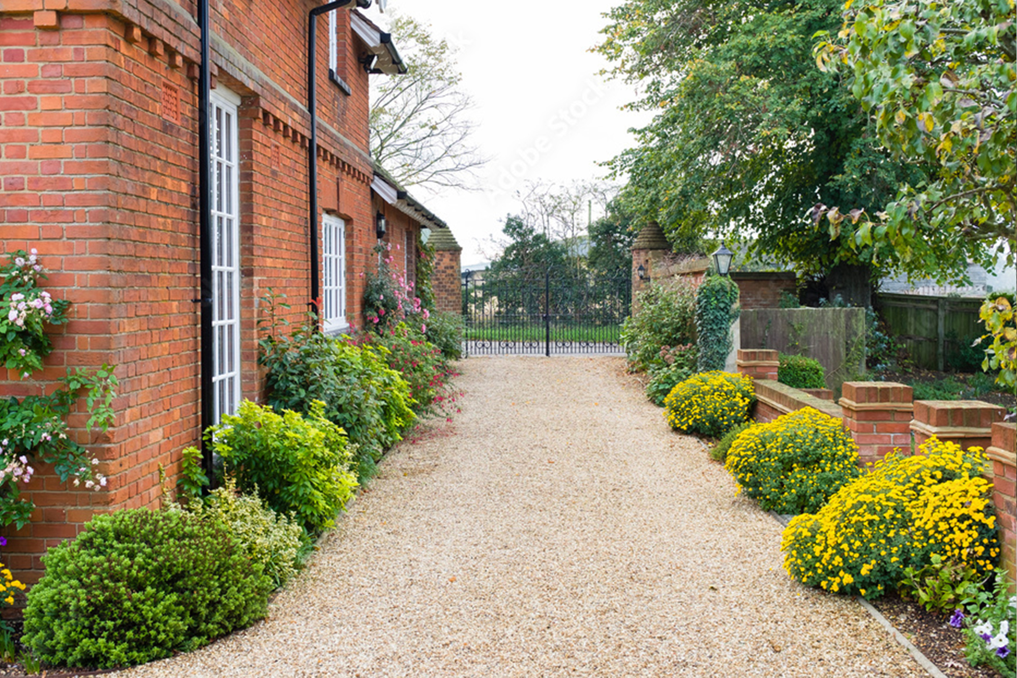 Table and chairs on the patio in an English country garden